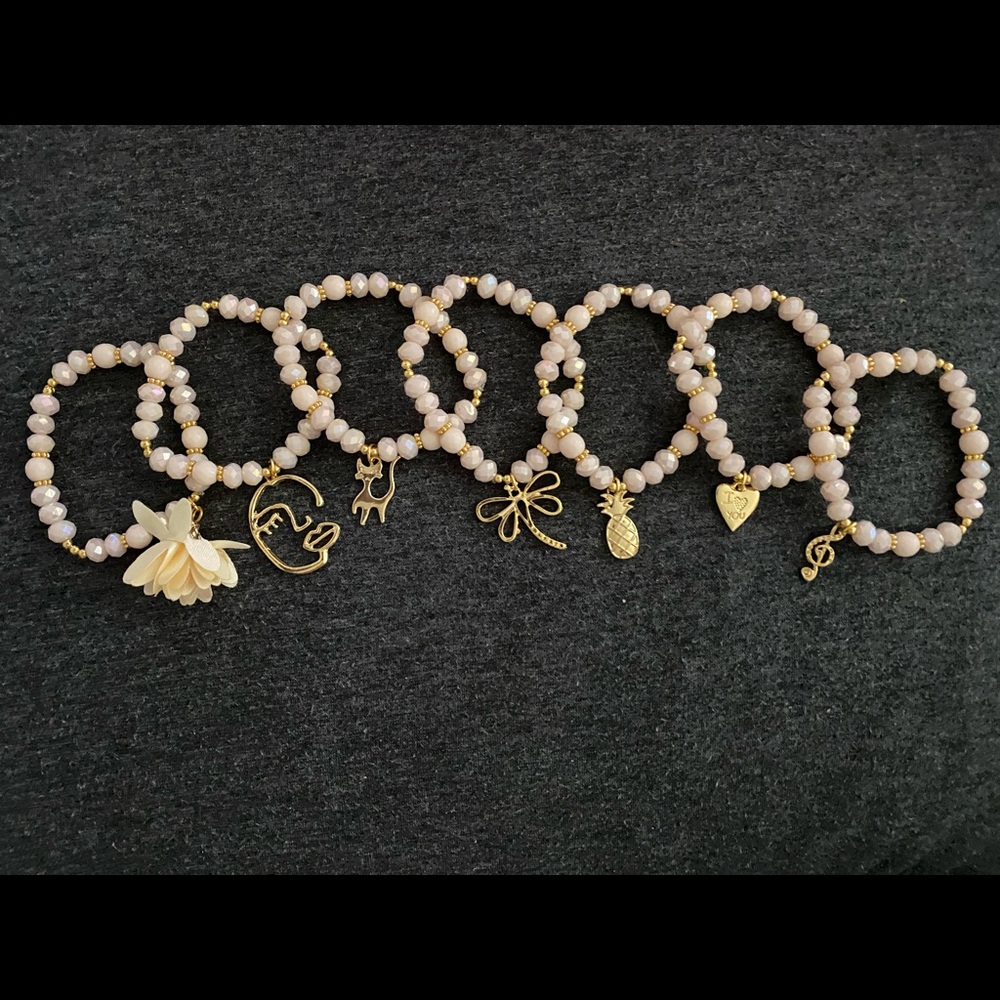 Artesanal 7 piece, hand made, bracelets in color beige.